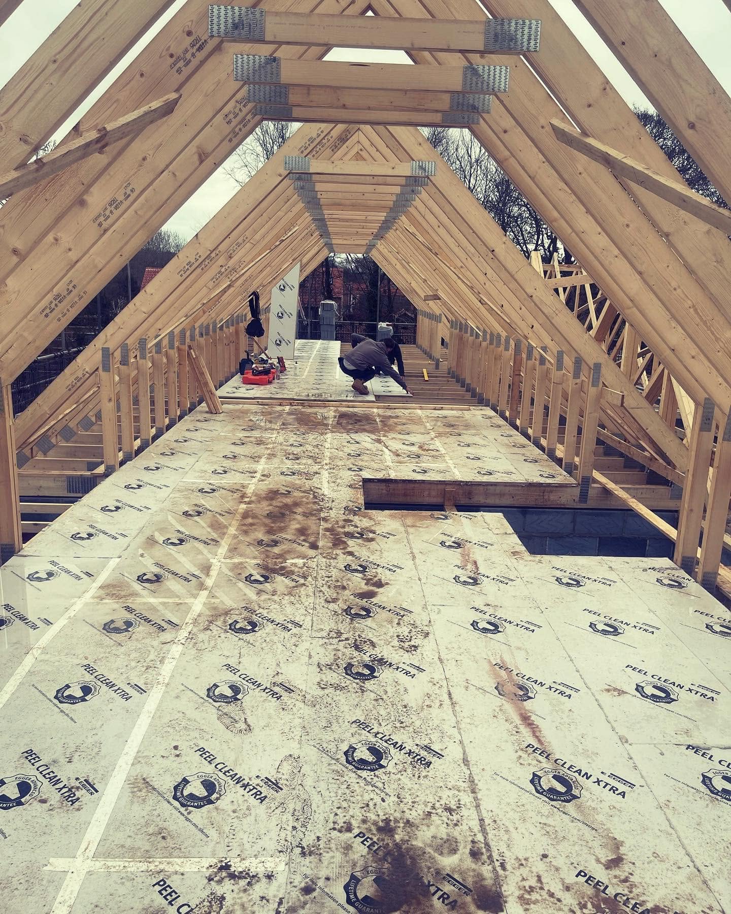 Roof trusses and decked loft floor during first fix carpentry