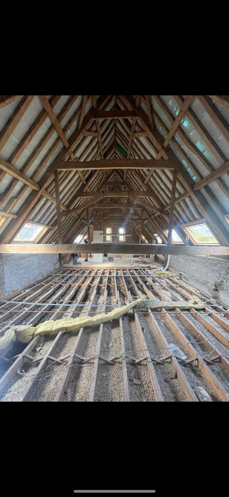 Historic barn roof structure exposed during strip out